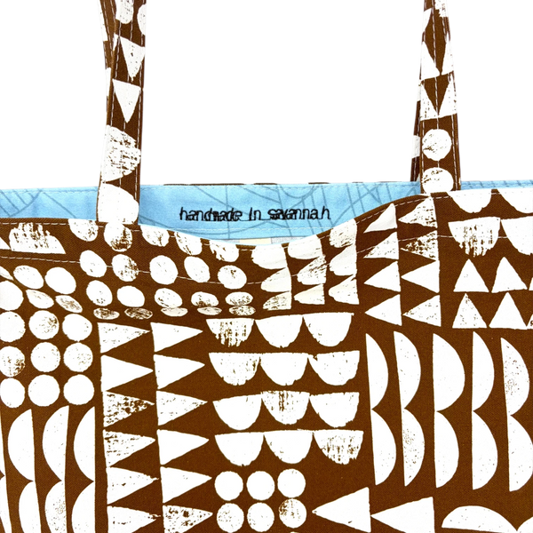mmb by hand organic cotton tote bag in brown with white geometric shapes and handmade in savannah interior label